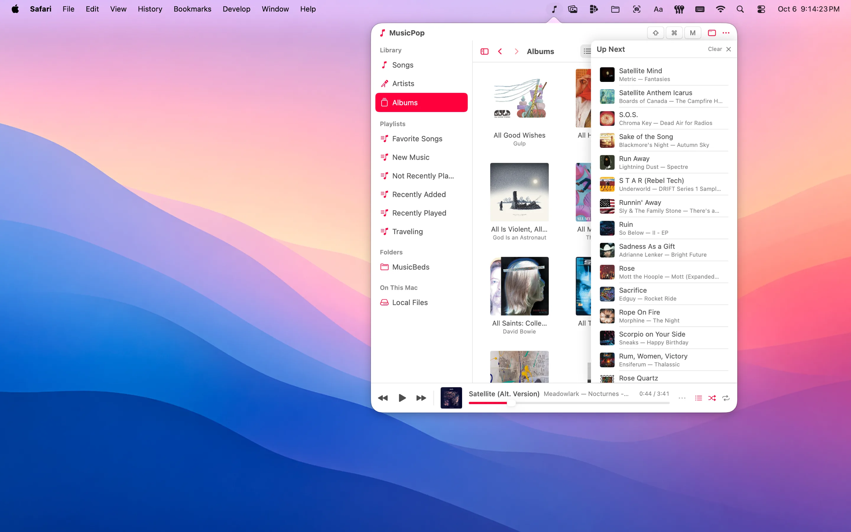 The Albums grid in the popover, with the Up Next queue open alongside it